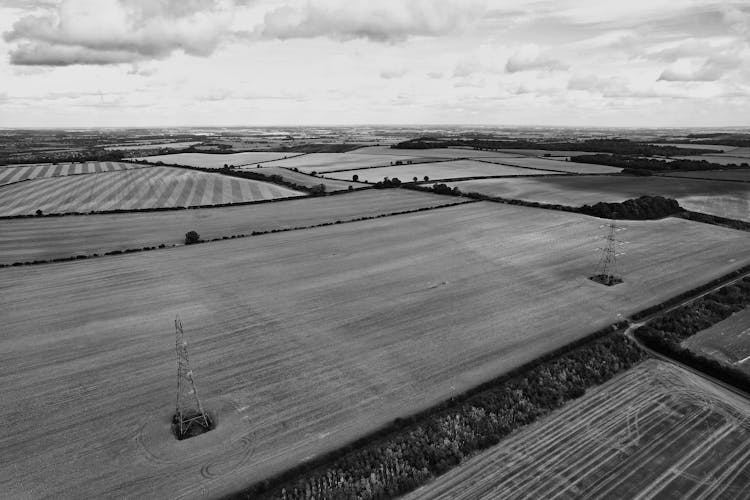 Electricity Pylons In Countryside Fields