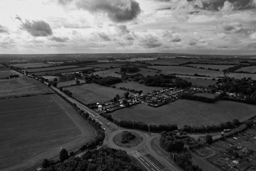 Grayscale Drone Shot of a Countryside in England