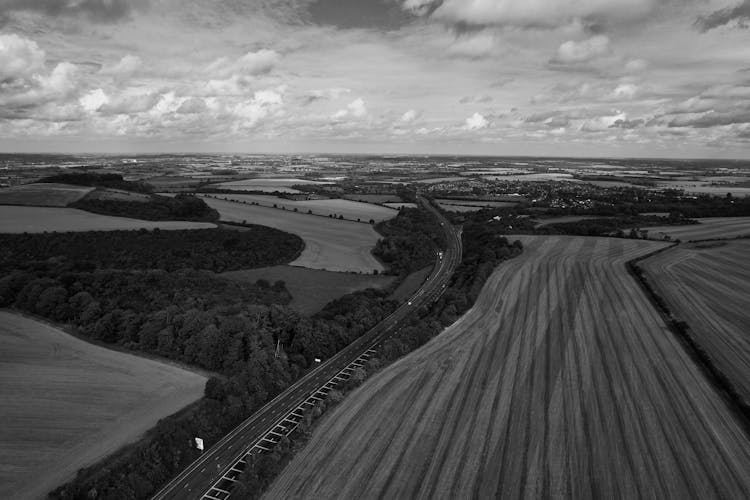 Grayscale Drone Shot Of A Countryside In England