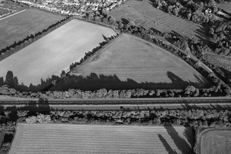 Grayscale Birds Eye View Of A Countryside In England