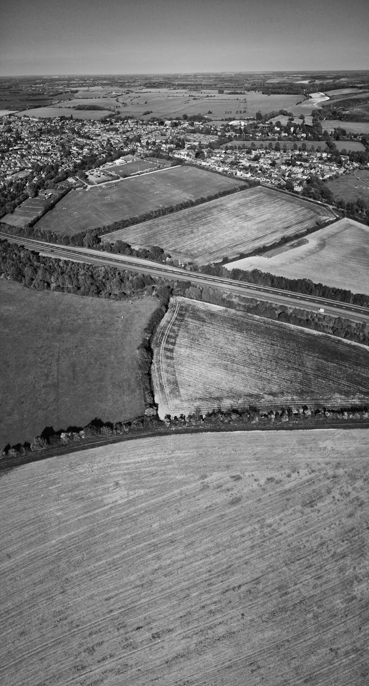 Grayscale Birds Eye View Of A Countryside In England