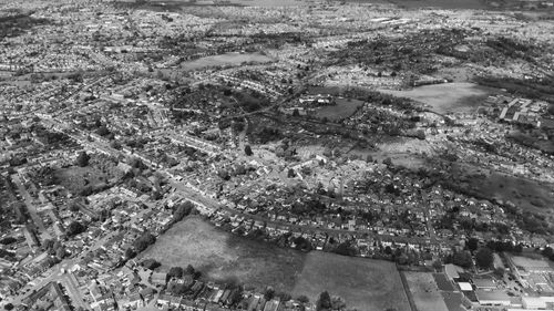 Free A monochrome aerial view of Luton, showcasing urban sprawl and landscape features. Stock Photo
