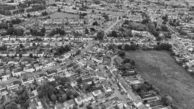 Aerial view of suburban Luton, England, showcasing housing and streets in monochrome.