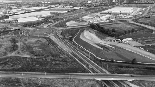 Free Aerial black and white view of a roundabout and transportation infrastructure in England. Stock Photo