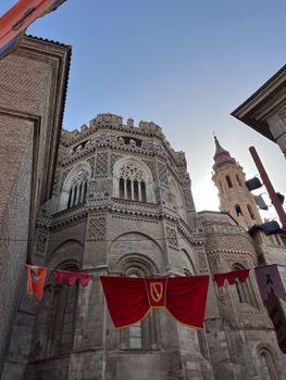 Gothic cathedral facade with ornate detailing under a clear sky.
