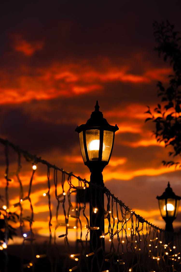 Lanterns And Lights On Dramatic Night Sky