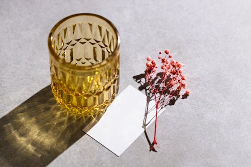 Free Drinking Glass and Card and Twig Stock Photo