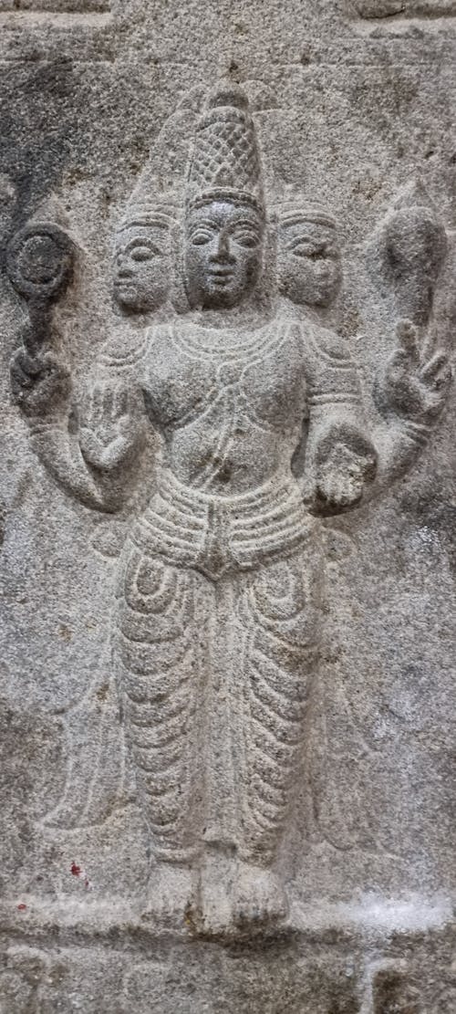 Close-up of Carved Hindu God on a Stone Wall 