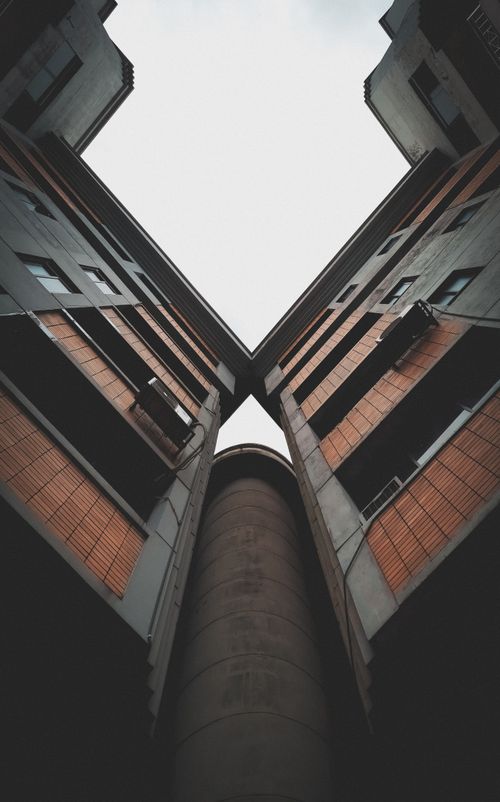 Free Low angle view of contemporary buildings facade in Dhaka with geometric lines and symmetry. Stock Photo