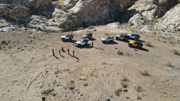 People With Jeeps Near Rocks