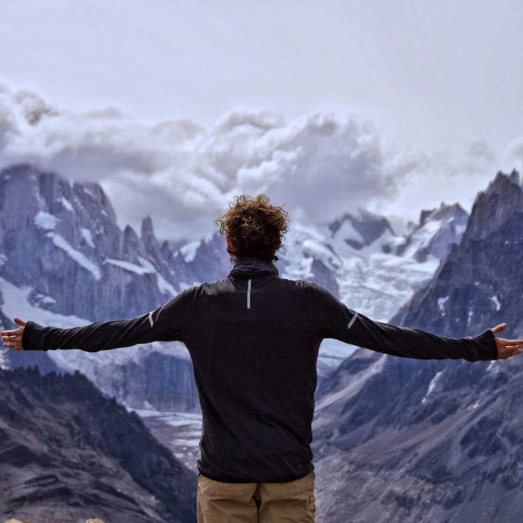 Back View of a Man with His Arms Apart