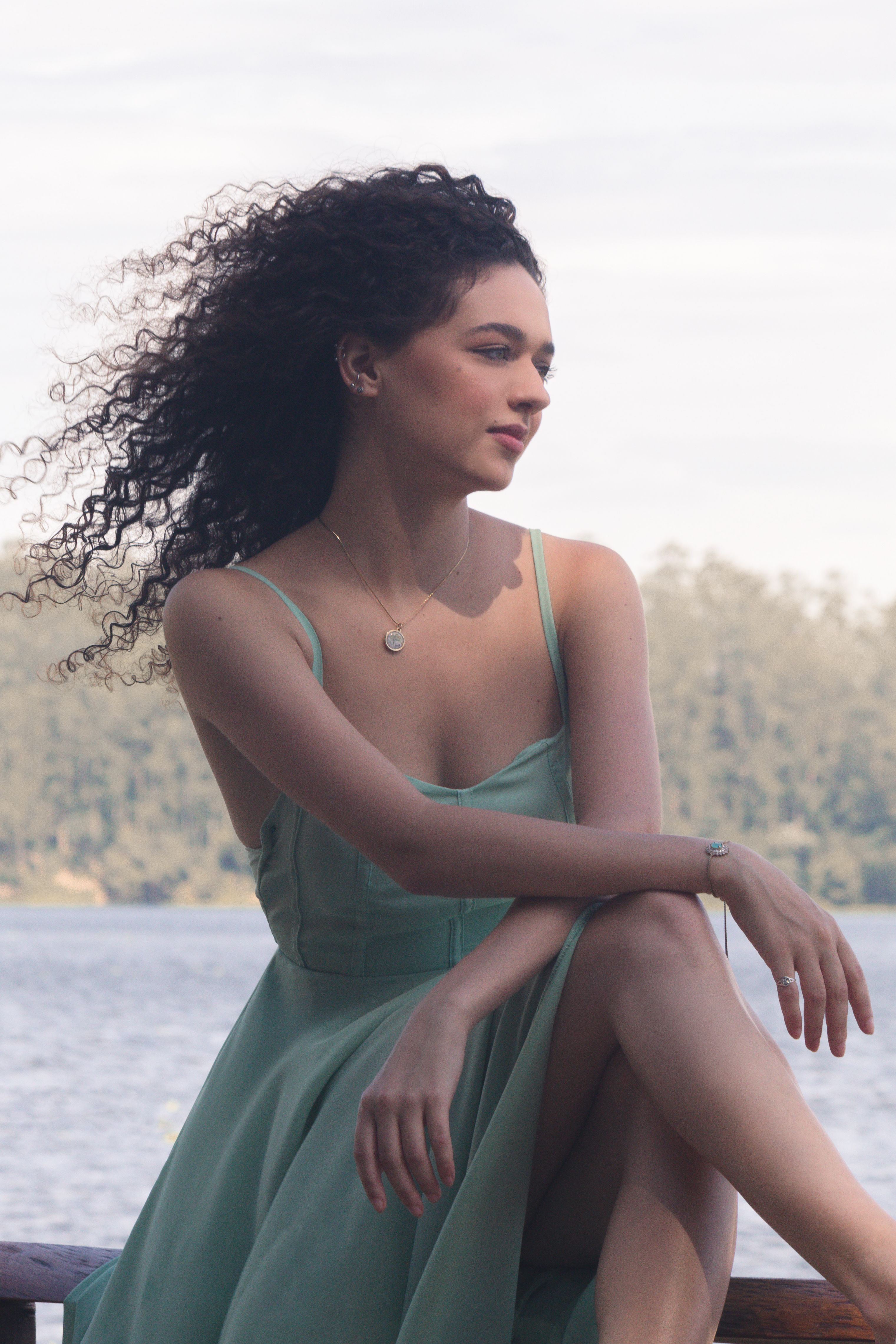 Woman in a Green Dress Looking Away · Free Stock Photo