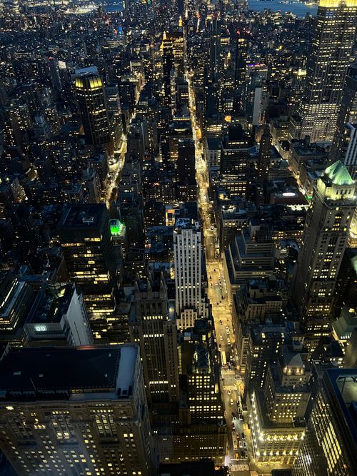 Free Breathtaking aerial cityscape of New York City illuminated at night, showcasing vibrant streets and towering skyscrapers. Stock Photo