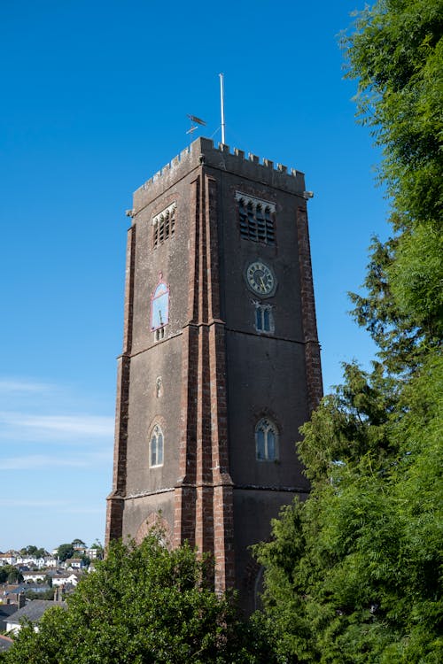 Tower of St Mary's Church in Brixham, Devon, England under Blue Sky