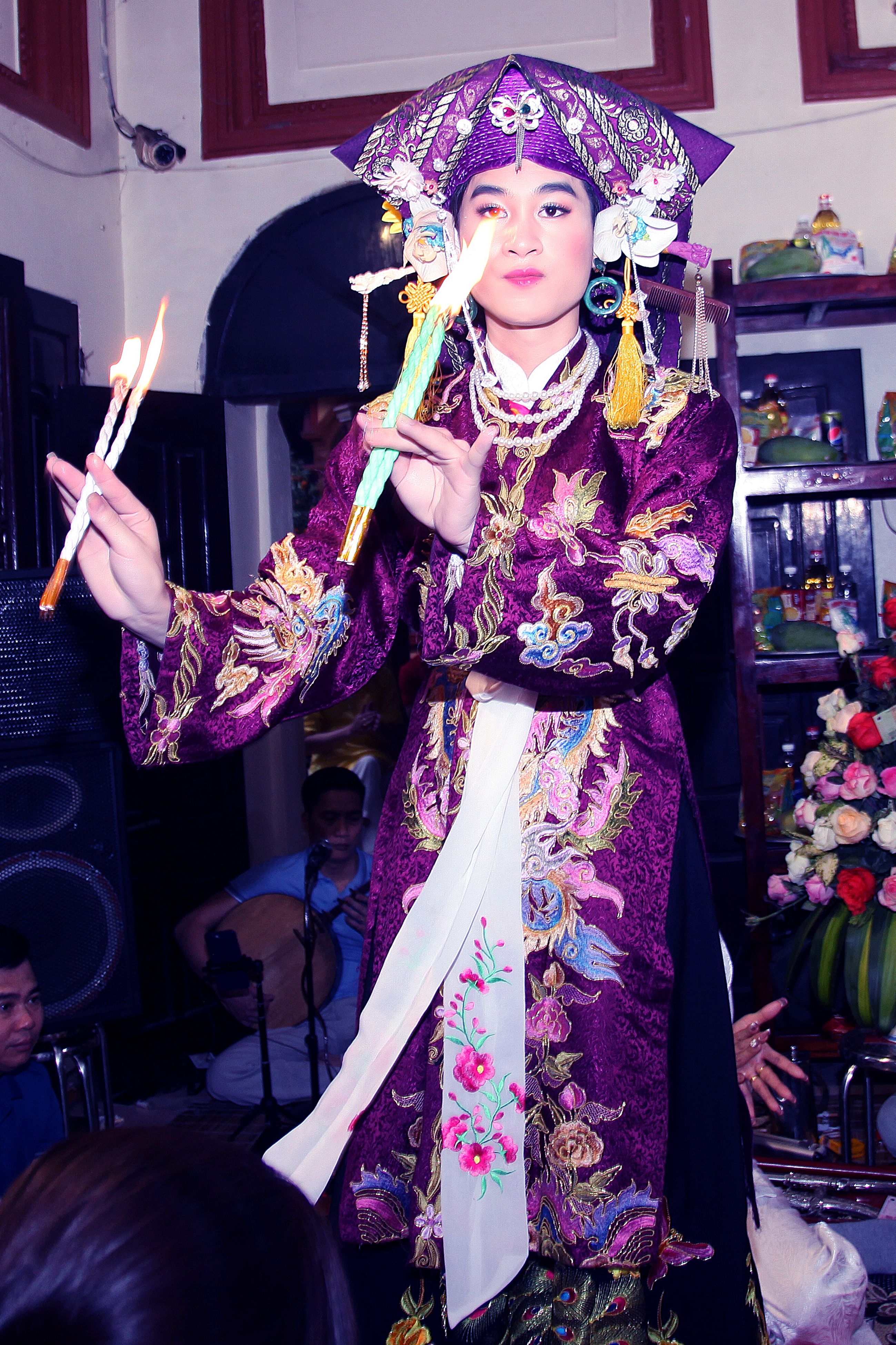 Captivating scene of a traditional Vietnamese dance with ornate headdress and costume.