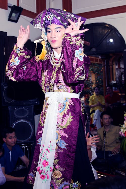 A Woman in Purple Kimono Dancing