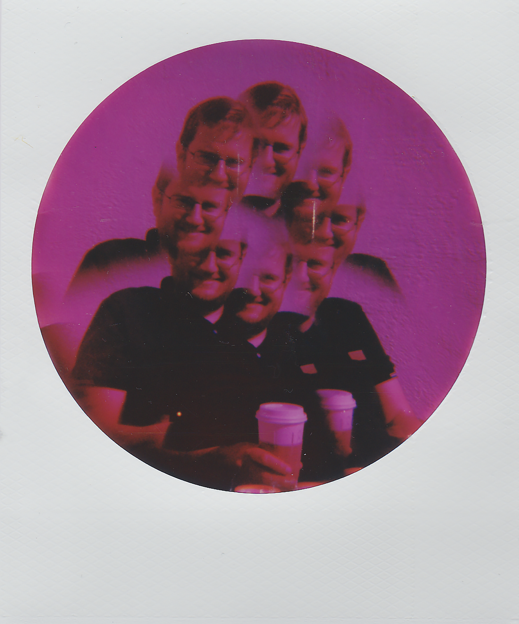 Creative portrait with double exposure and vivid purple hues, featuring a coffee cup.