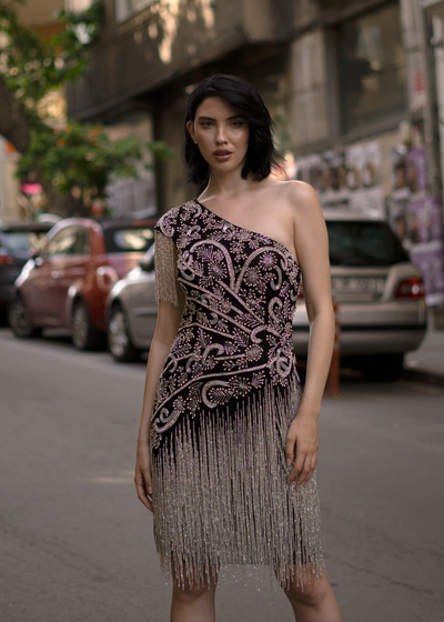 Woman wearing one shoulder cocktail dress