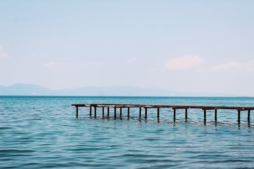 grátis Foto profissional grátis de água, céu azul, litoral Foto profissional