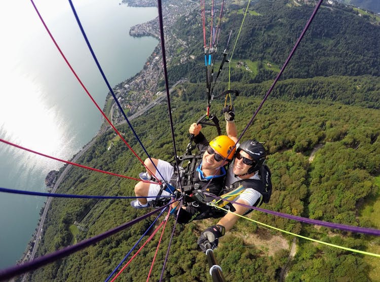 Two People Paragliding Together