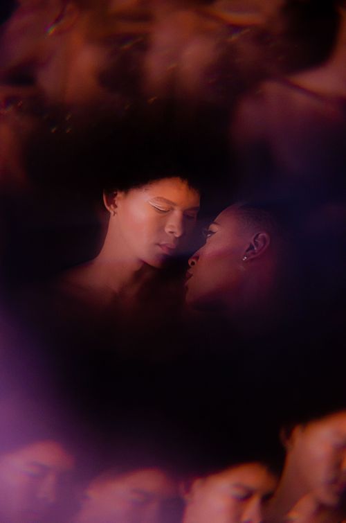 Free Artistic and dreamy portrait of a couple sharing a tender moment in an intimate setting. Stock Photo