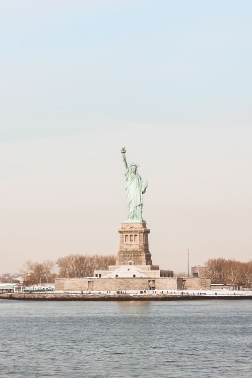 Free Captivating view of the Statue of Liberty against a clear sky, a symbol of freedom in New York City. Stock Photo