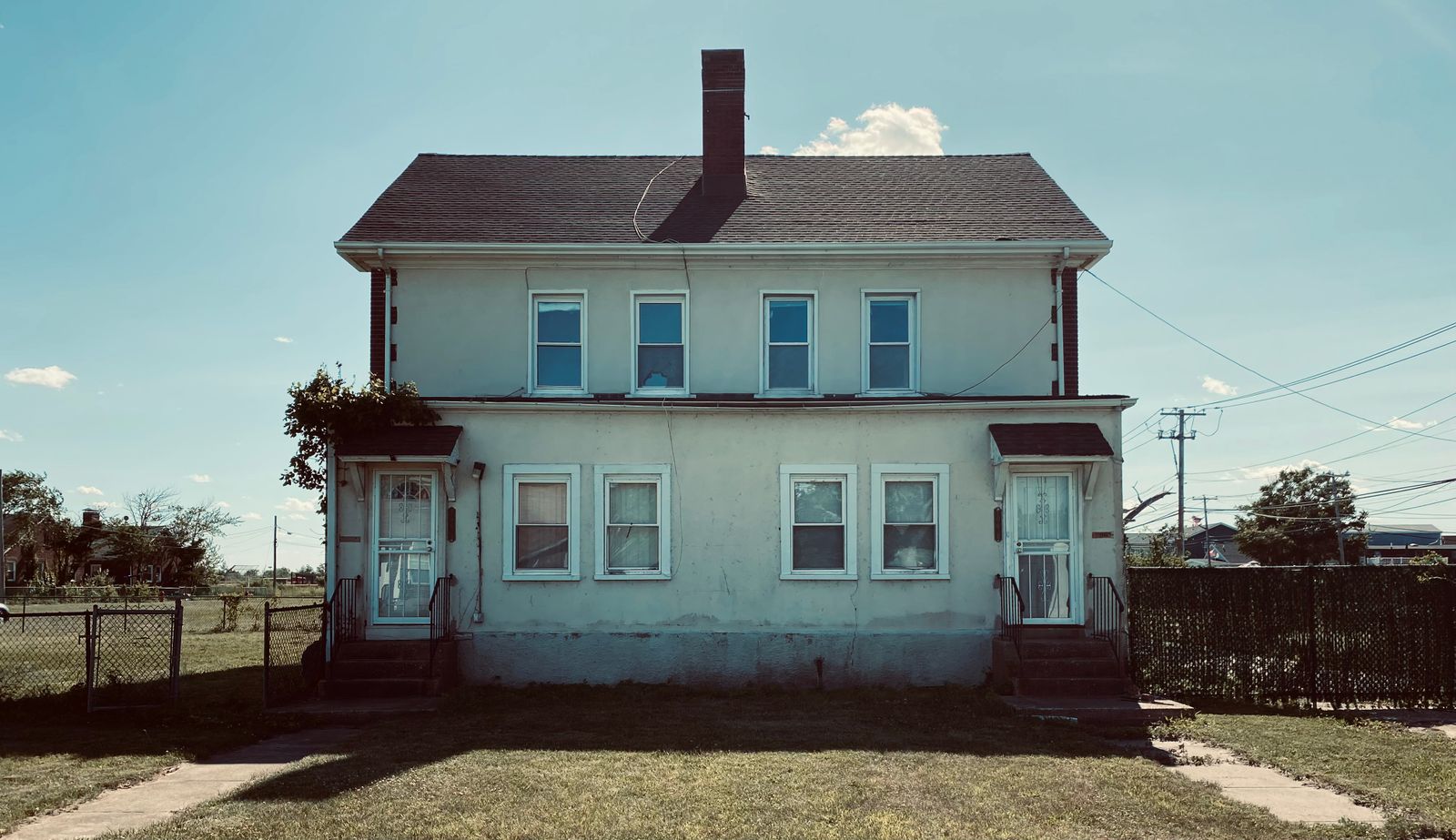 Two-story residential house with front entrances