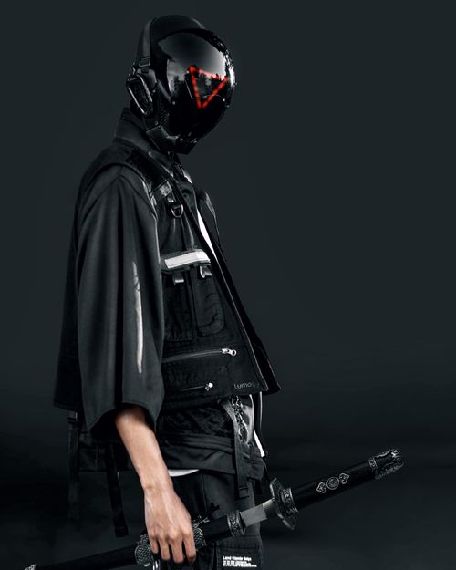 Free A stylish cyberpunk portrait showcasing a futuristic costume with a helmet and sword. Stock Photo