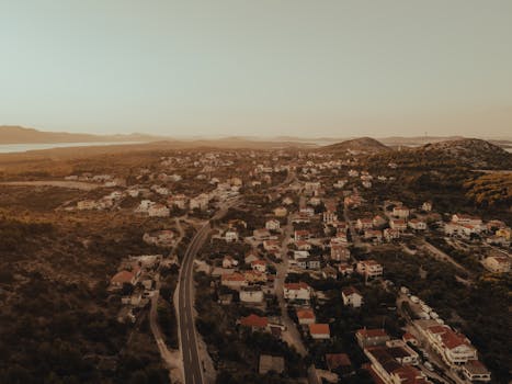 Explore the stunning aerial view of Pakoštane, a charming Croatian village, captured at sunset.