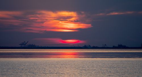 Free Experience a dramatic sunset over Daphne, Alabama's port with vivid colors and serene reflections. Stock Photo