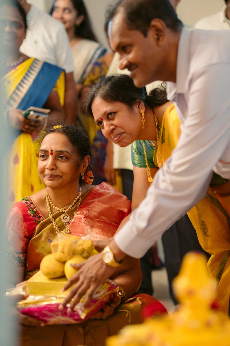 People Offering Fruits At The Wedding