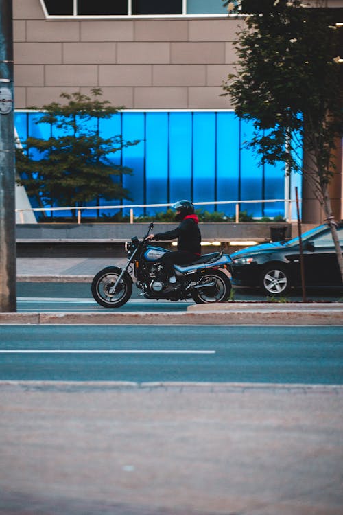 A Man Riding Motorcycle on the Road