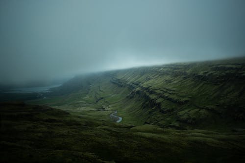 Green Mountain Under Gray Sky