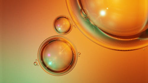 Water Bubbles on Orange Liquid