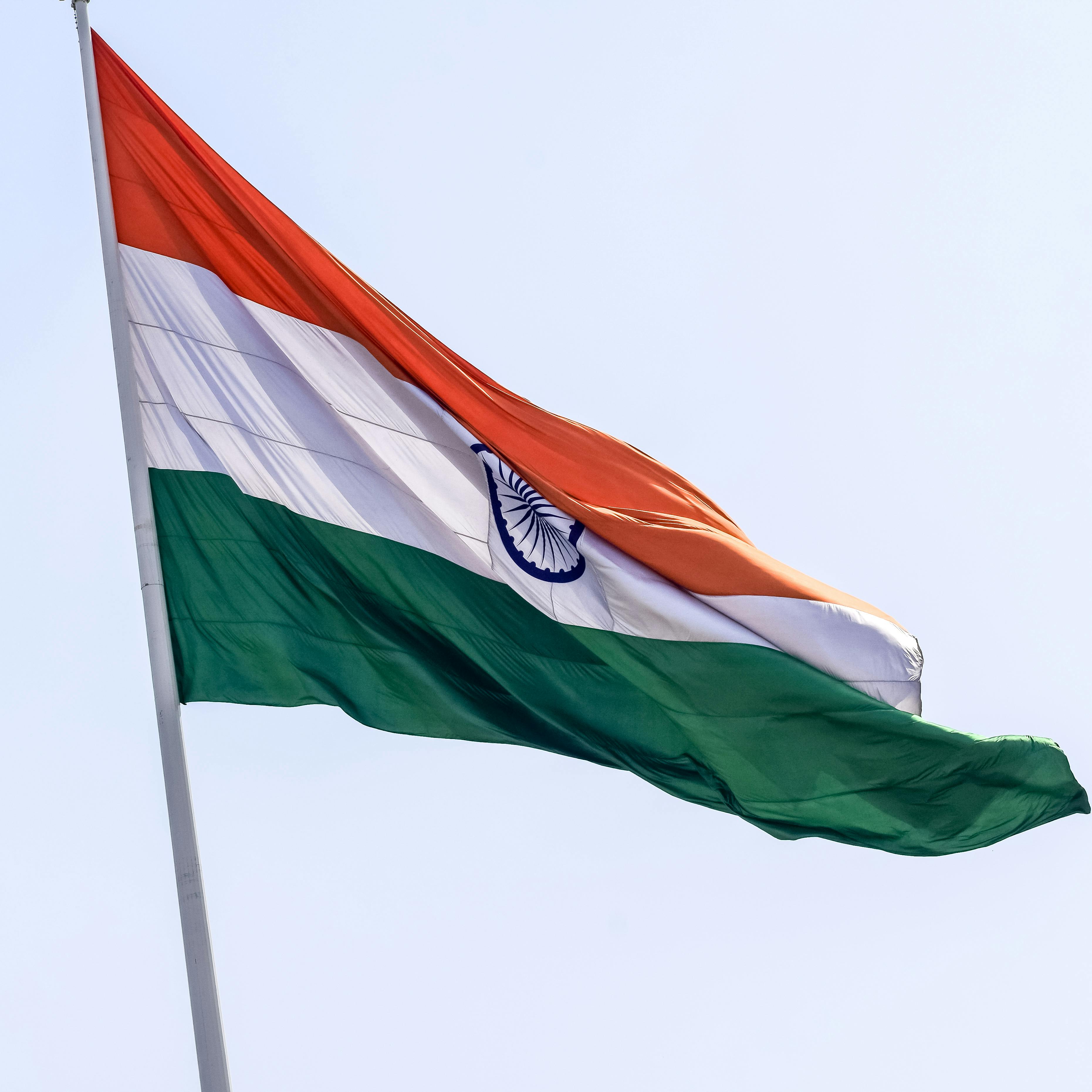 Waving Flag Under the Blue Sky · Free Stock Photo