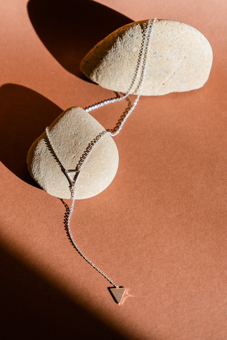 Silver Triangle Necklace Presented On Sandstone