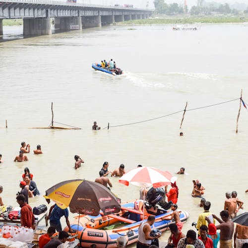 People Swimming on the River