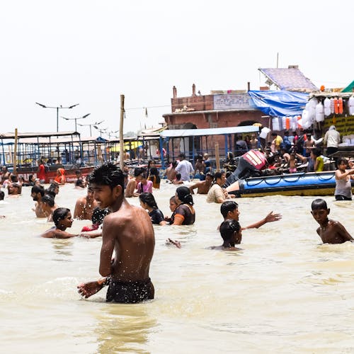 People Swimming on the River