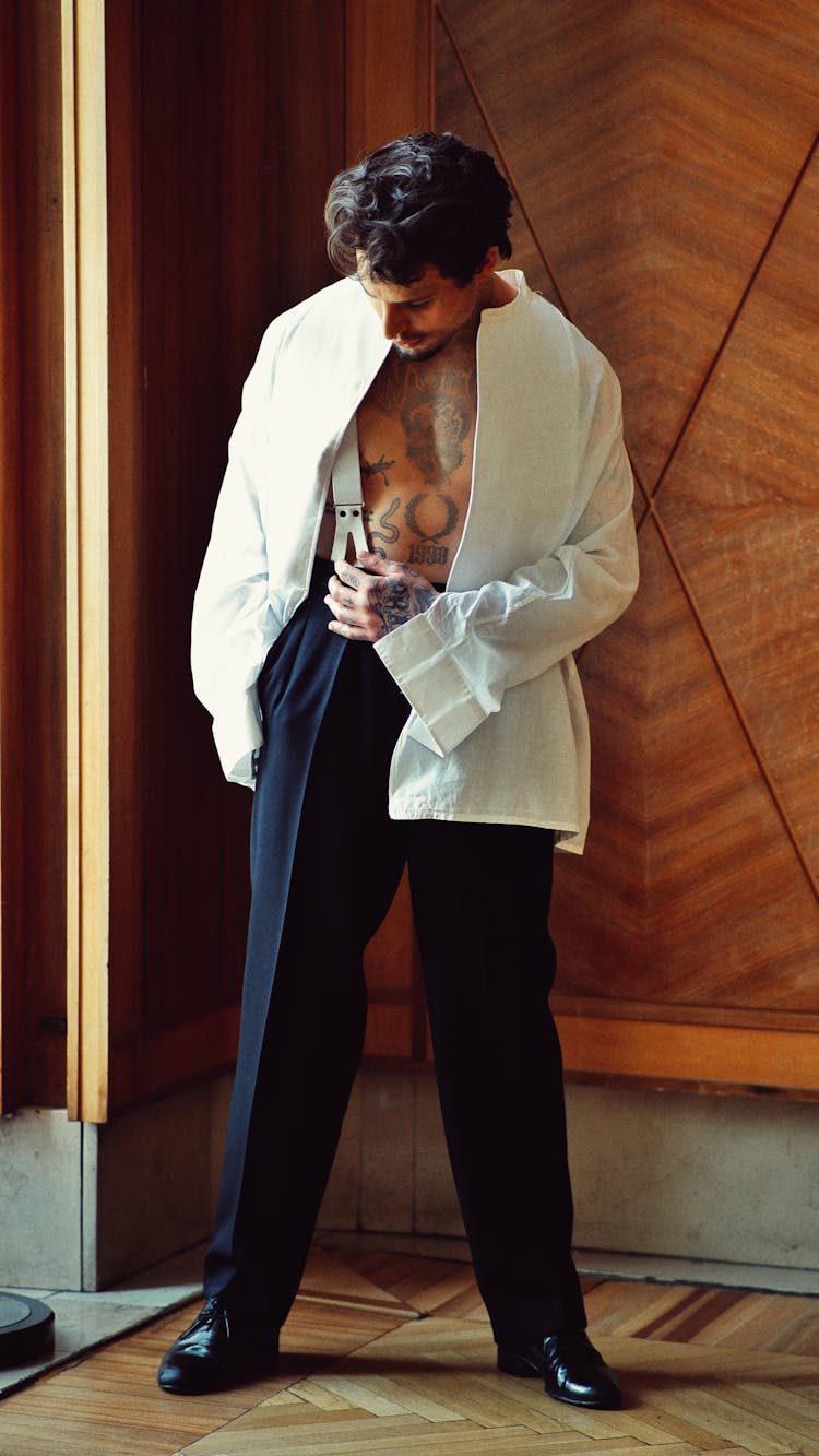 Fashion Man In White Unbuttoned Shirt And Business Pants