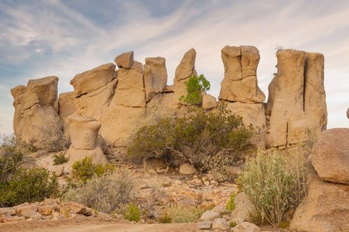Free Explore breathtaking natural rock formations in a serene desert landscape. Stock Photo