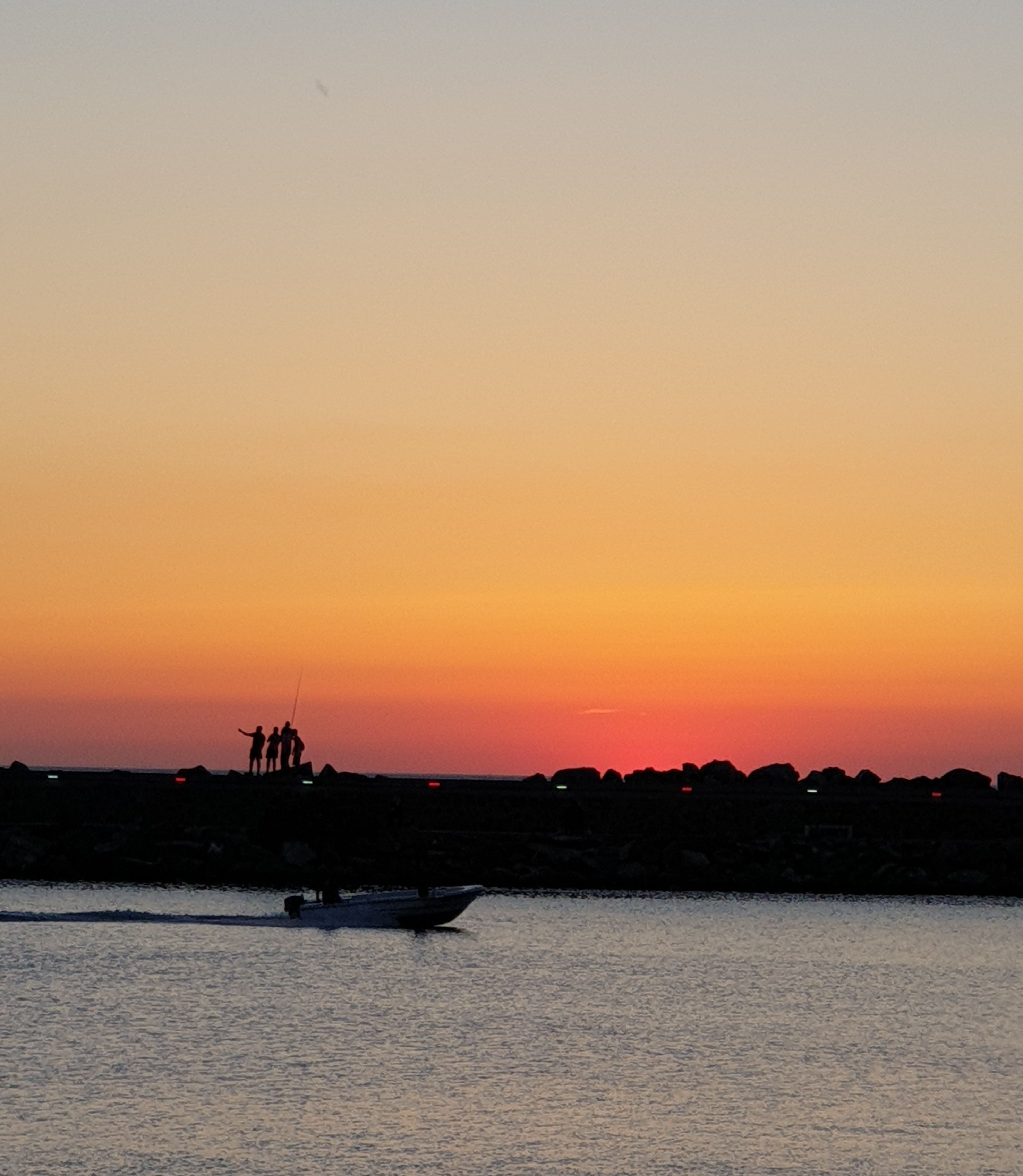 Silhouette of Motorboat on Body of Water · Free Stock Photo