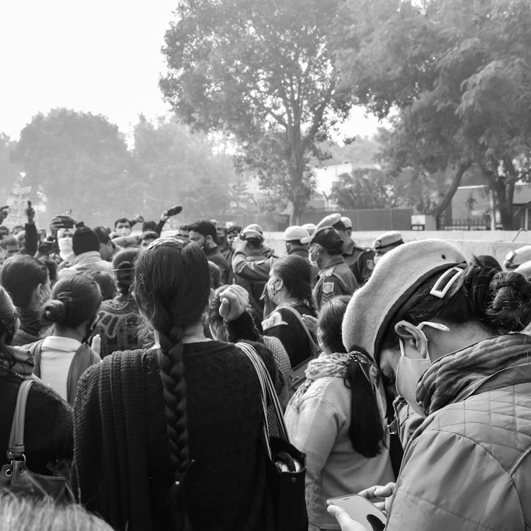 Crowd Gathering In Black And White