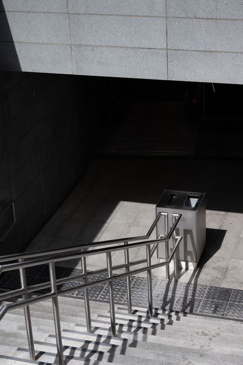 Free Explore the modern design of a Copenhagen metro station entrance illuminated by sunlight. Stock Photo