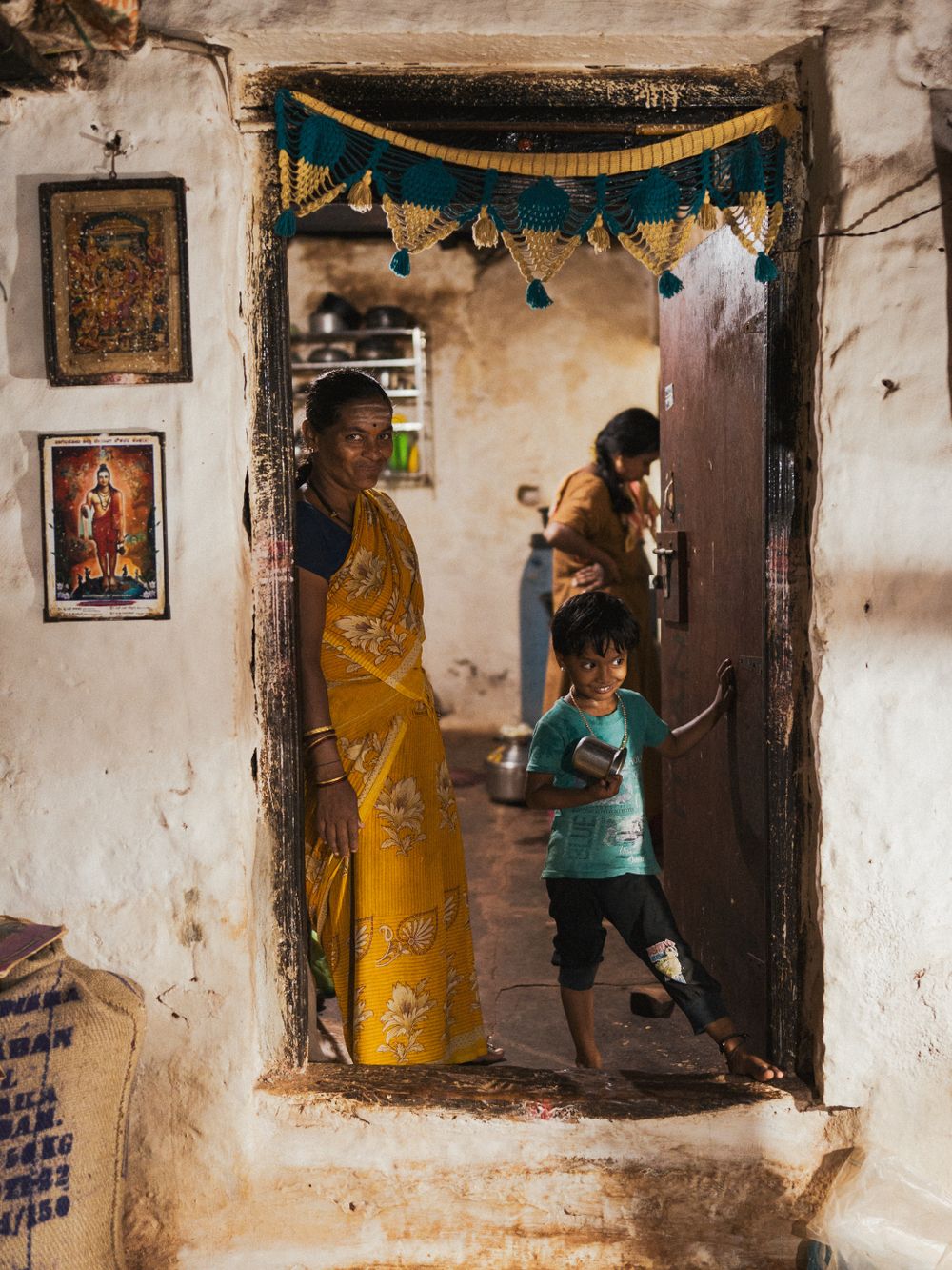 Indian family at the entrance of their home