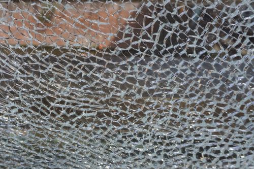 Free Detailed view of shattered glass pieces creating a textured pattern Stock Photo