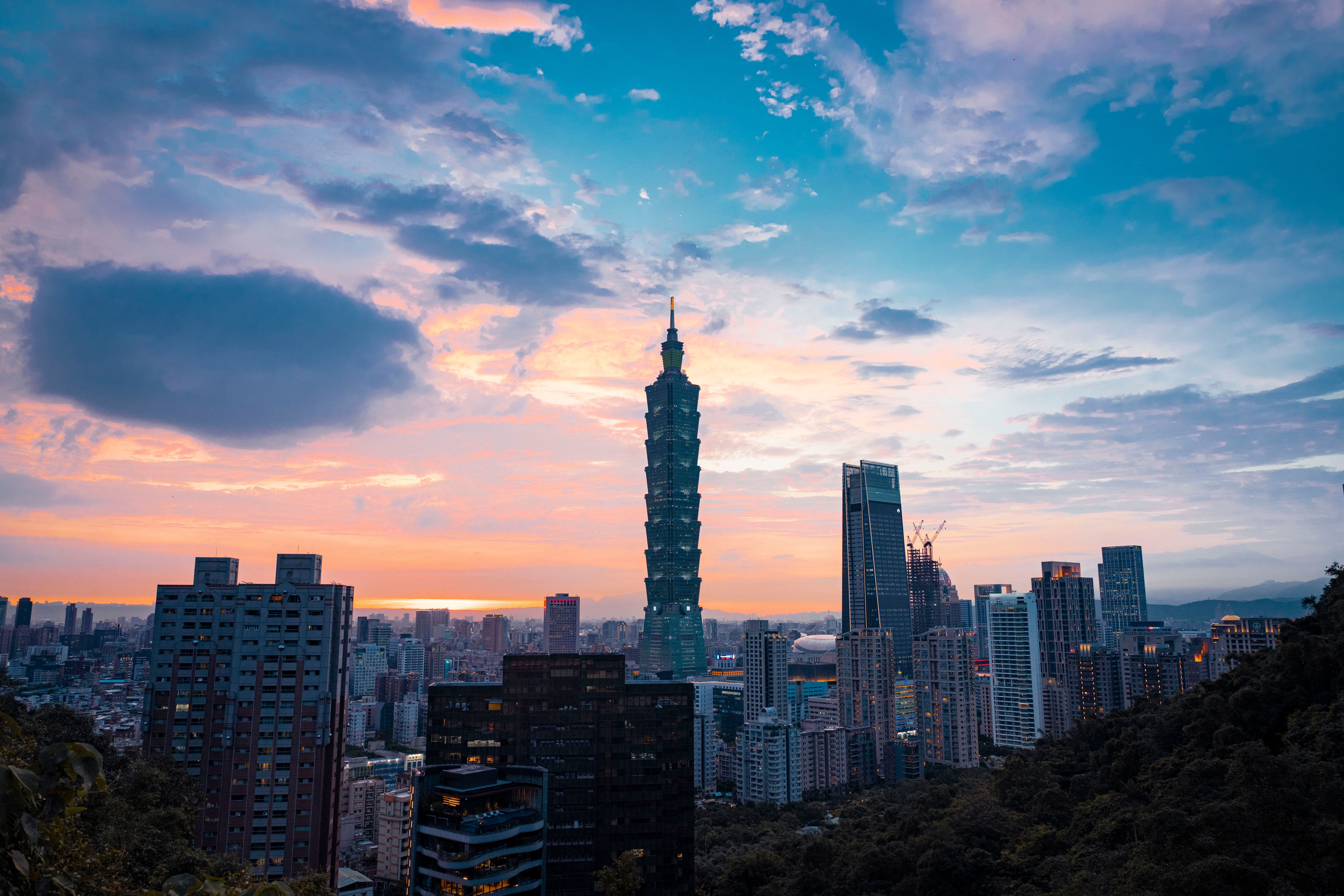 City Skyline Under Blue Sky and White Clouds · Free Stock Photo