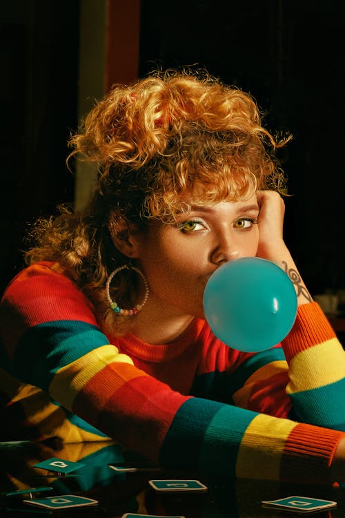 Woman Blowing a Bubble Gum