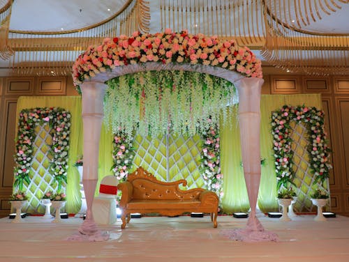 Brown Couch under Blooming Flowers