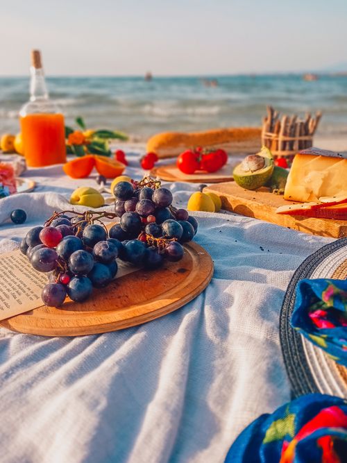 Free Colorful beach picnic with fruits and cheese near the sea in Turkey. Stock Photo