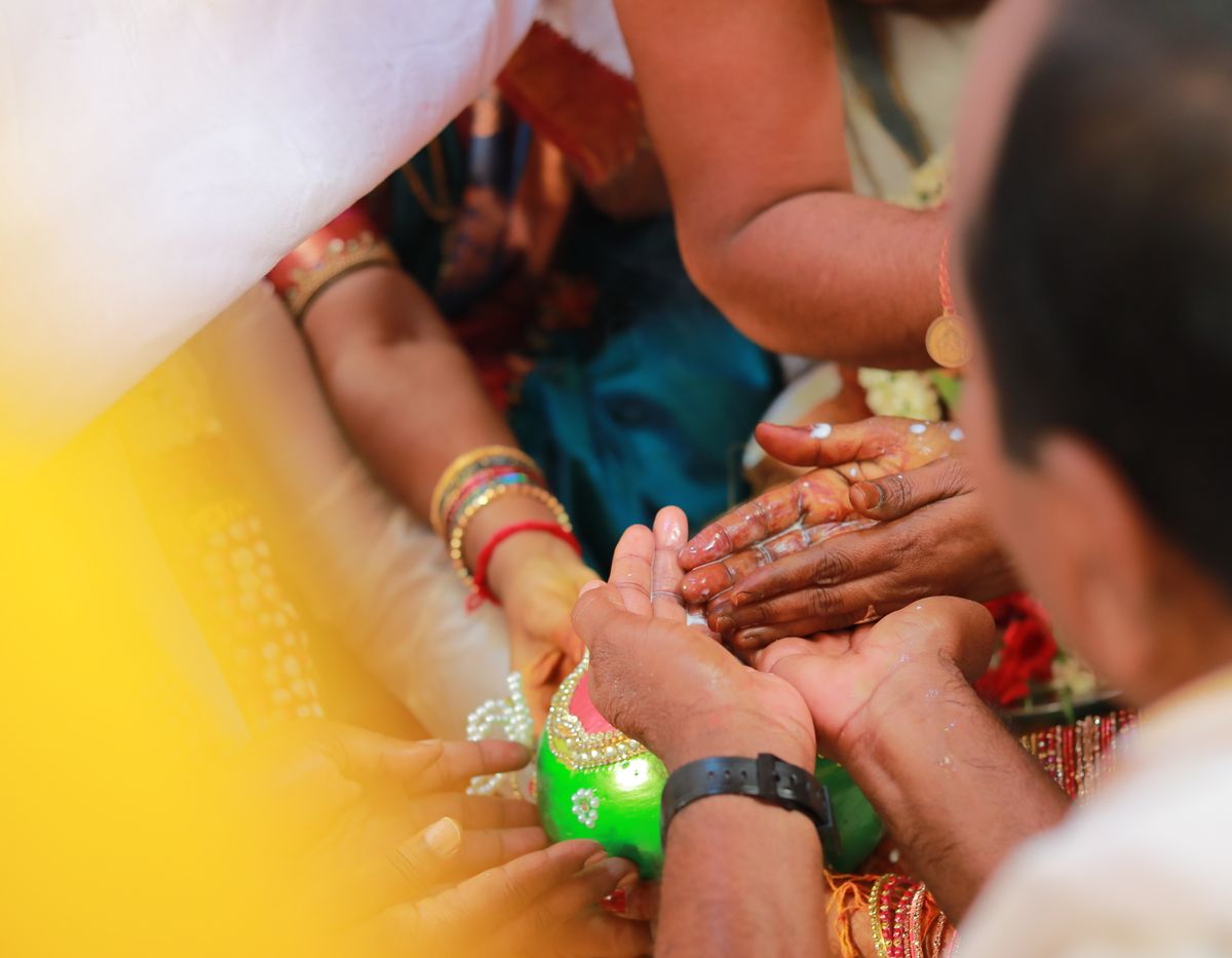 Hands joined during a traditional wedding ritual
